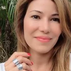 Actress, Iris Almario from Nobodies TV, Jane The Virgin, NCIS, Code Black and co-founder of WUFAW, wearing our All You Need is Love and Be Their Voice Rings.
